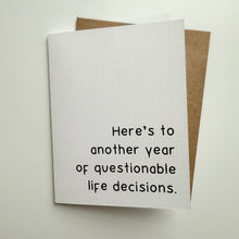 Load image into Gallery viewer, &quot;Here&#39;s to another year of questionable life decisions.&quot; Quoted. Greeting Card
